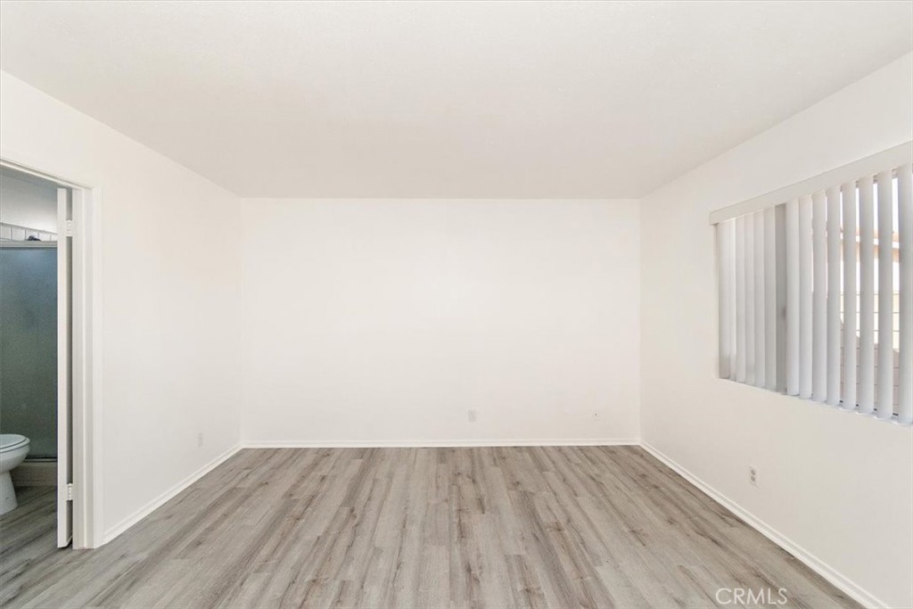 1330 La Serena Drive Glendora, CA 91740 - Photo 20 of 36 an empty room with wooden floor and windows