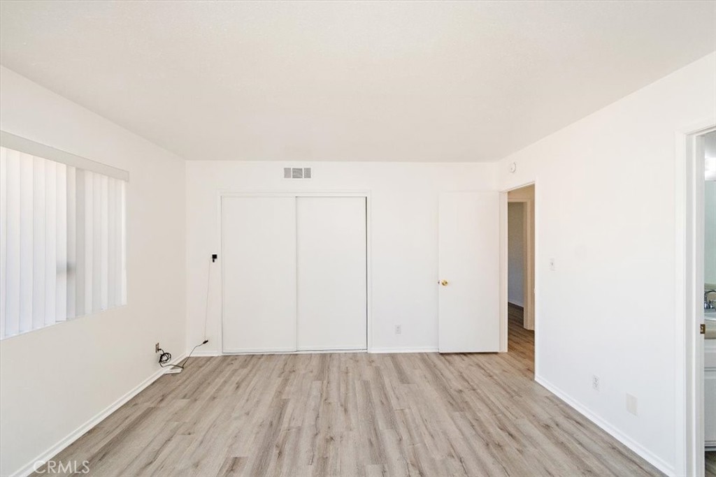 1330 La Serena Drive Glendora, CA 91740 - Photo 21 of 36 an empty room with wooden floor and windows