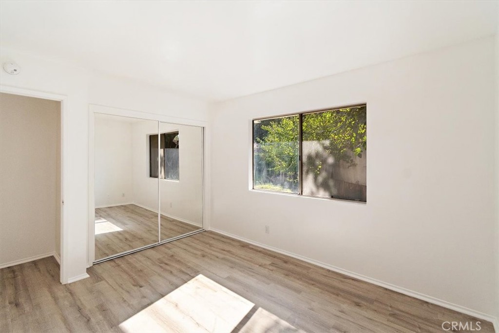 1330 La Serena Drive Glendora, CA 91740 - Photo 27 of 36 an empty room with wooden floor and windows