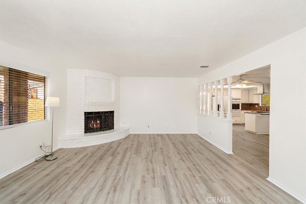 1330 La Serena Drive Glendora, CA 91740 - Photo 8 of 36 a view of empty room with wooden floor and fireplace