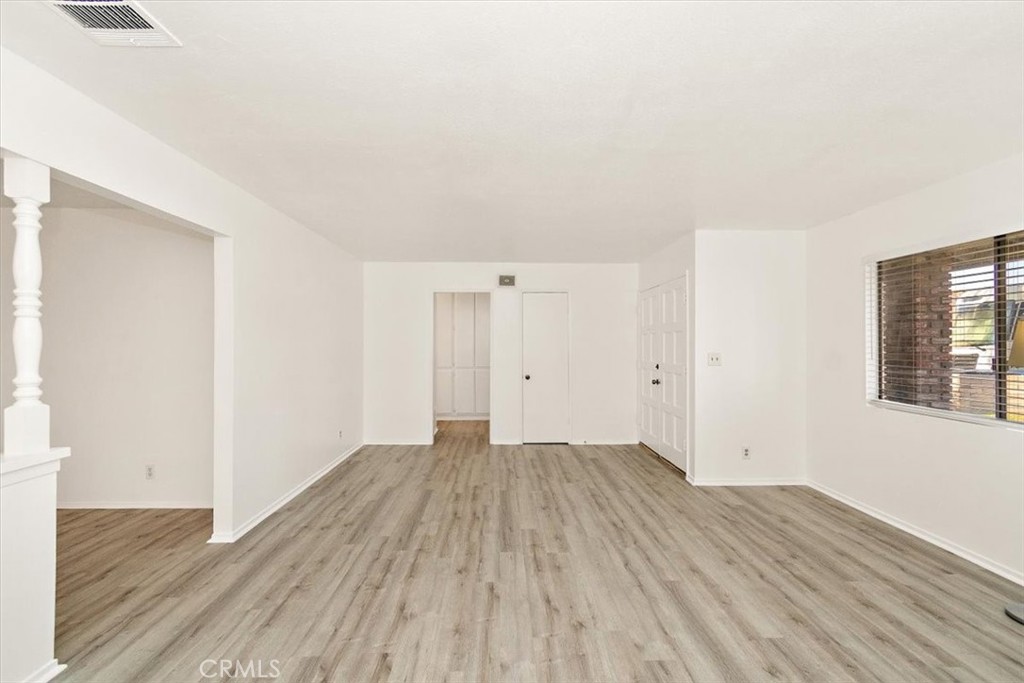 1330 La Serena Drive Glendora, CA 91740 - Photo 10 of 36 an empty room with wooden floor and windows