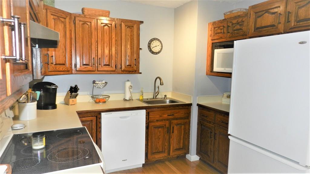 10 Marion Road Middleboro, MA 02346 - Photo 3 of 39 a kitchen with a sink and a refrigerator