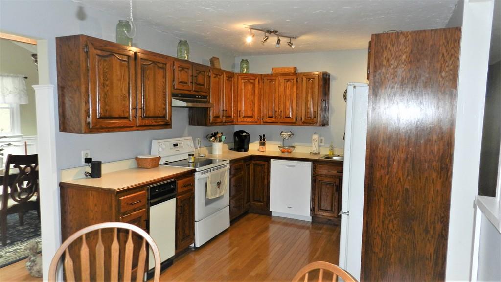 10 Marion Road Middleboro, MA 02346 - Photo 6 of 39 a kitchen with a sink stove and cabinets