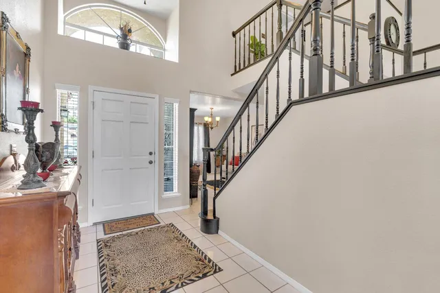 a view of entryway and hall with a rug
