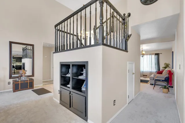 a view of living room with furniture and staircase