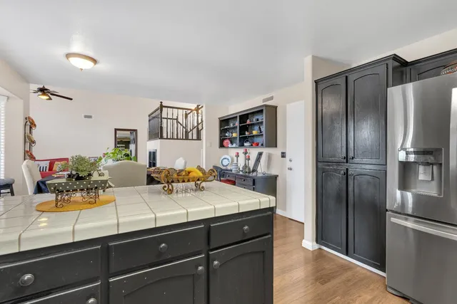 a kitchen with a refrigerator and a sink