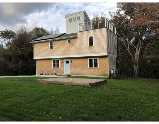 32 Pleasant View Drive Little Compton, RI 02837 - Photo 24 of 37 a front view of a house with a garden and yard