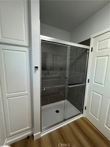 a bathroom with a glass shower door