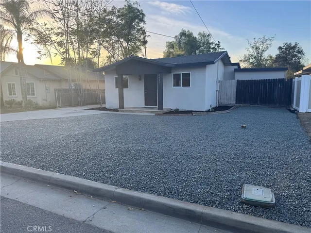 a view of a house with a back yard