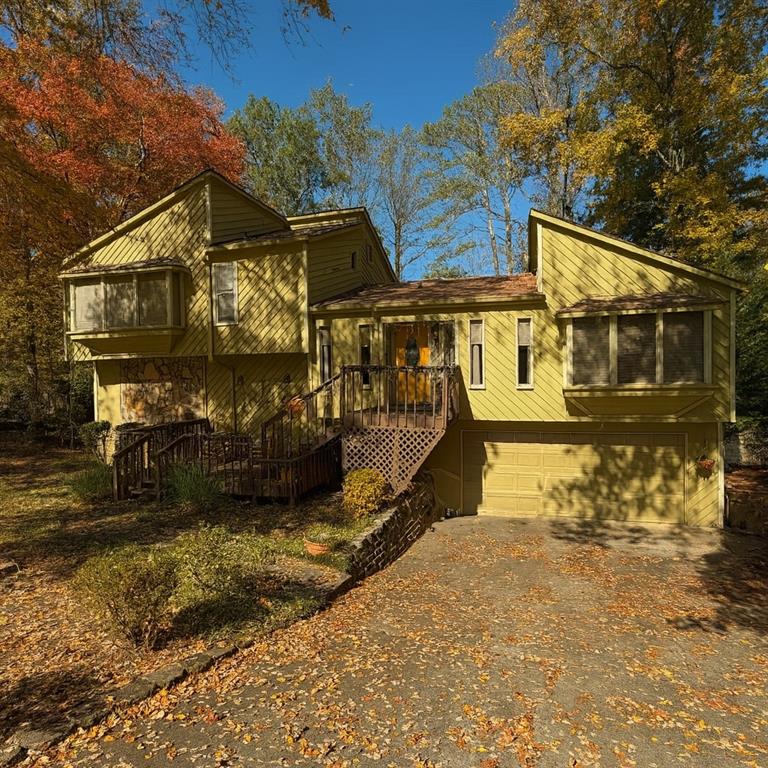 a view of a street with large trees