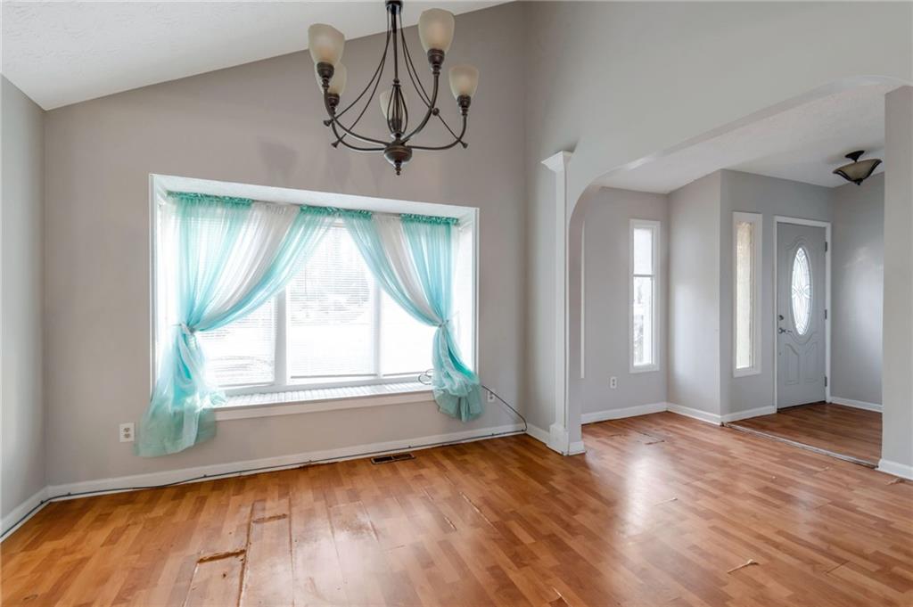 3523 Liberty Ridge Trail Marietta, GA 30062 - Photo 11 of 25 an empty room with wooden floor and windows