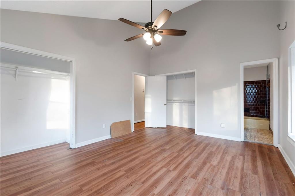 3523 Liberty Ridge Trail Marietta, GA 30062 - Photo 19 of 25 a view of an empty room with wooden floor and a ceiling fan