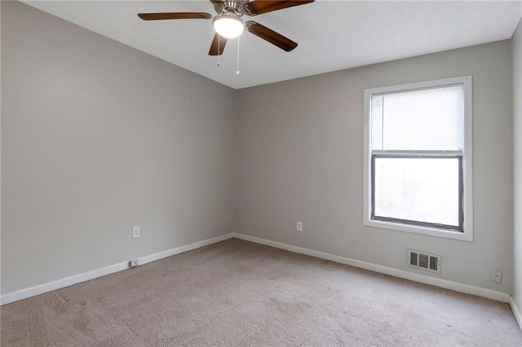 3523 Liberty Ridge Trail Marietta, GA 30062 - Photo 24 of 25 an empty room with a window and a fan