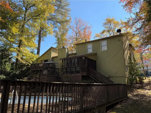 a view of a house with a tree