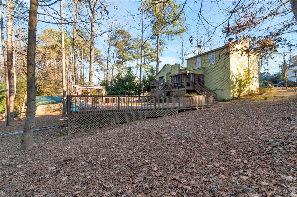3523 Liberty Ridge Trail Marietta, GA 30062 - Photo 5 of 25 a view of a yard with plants and trees