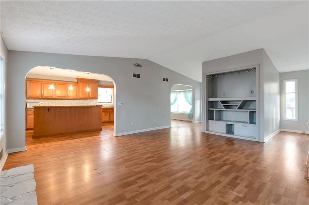 3523 Liberty Ridge Trail Marietta, GA 30062 - Photo 7 of 25 a view of empty room with wooden floor and kitchen view