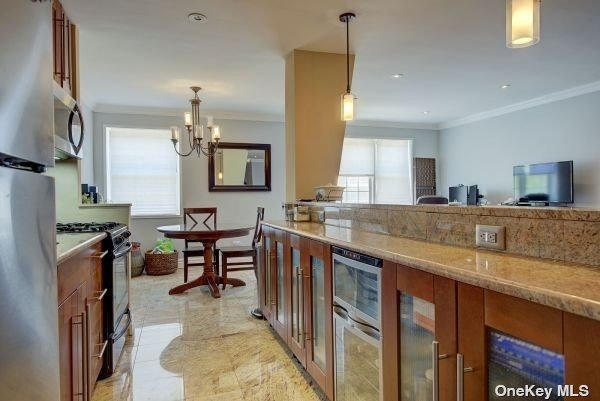 a large kitchen with lots of counter space a sink a window and stainless steel appliances