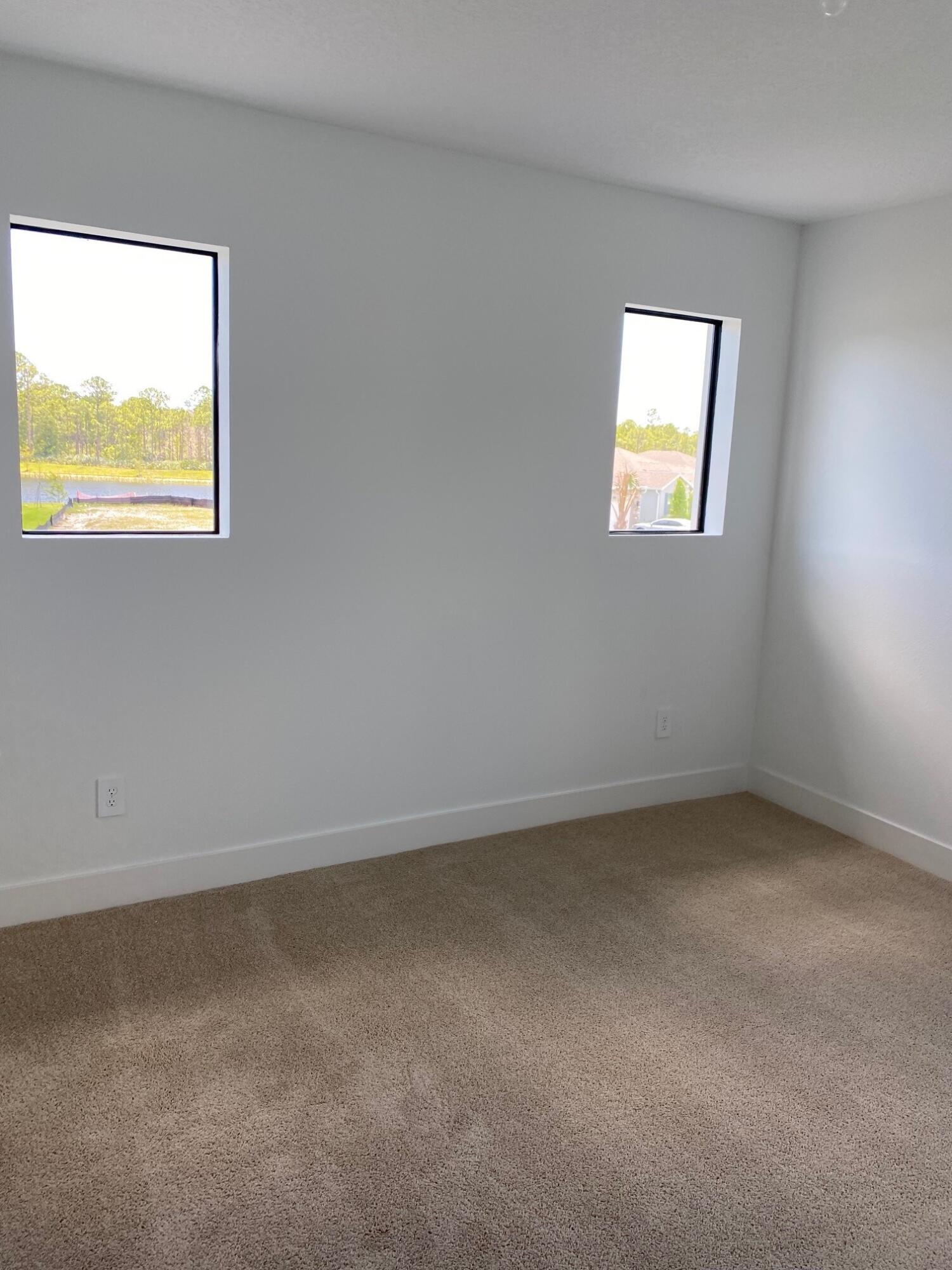 6810 Southeast Park Trace Drive Stuart, FL 34997 - Photo 11 of 21 a view of an empty room with a window