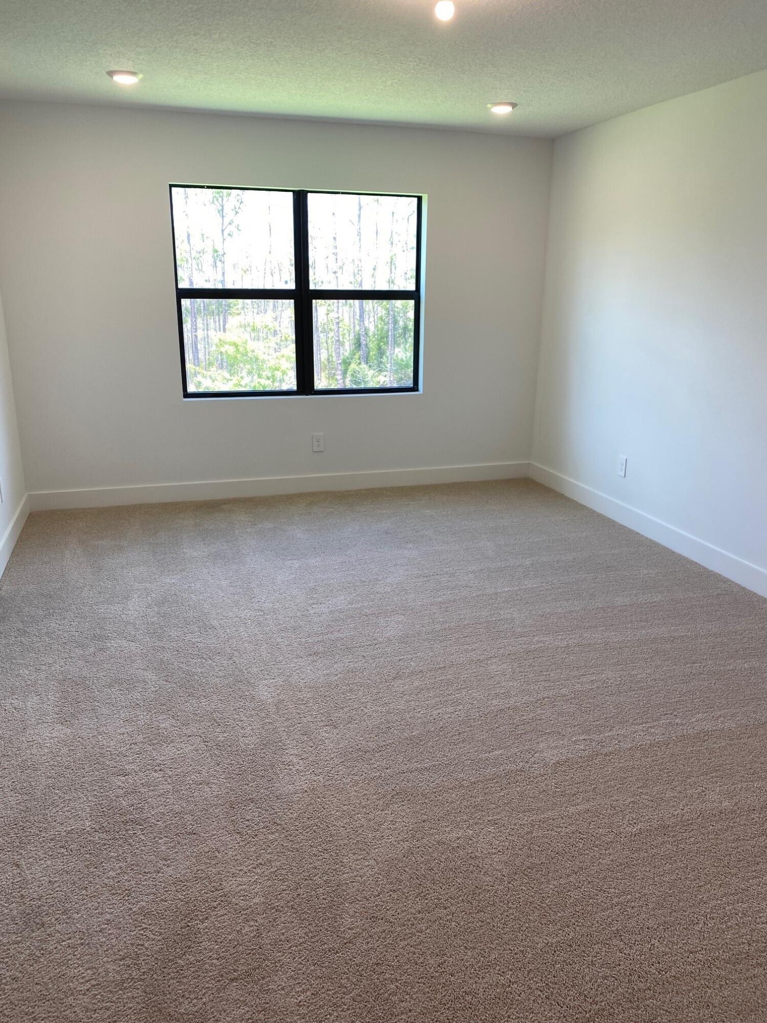 6810 Southeast Park Trace Drive Stuart, FL 34997 - Photo 14 of 21 an empty room with a window