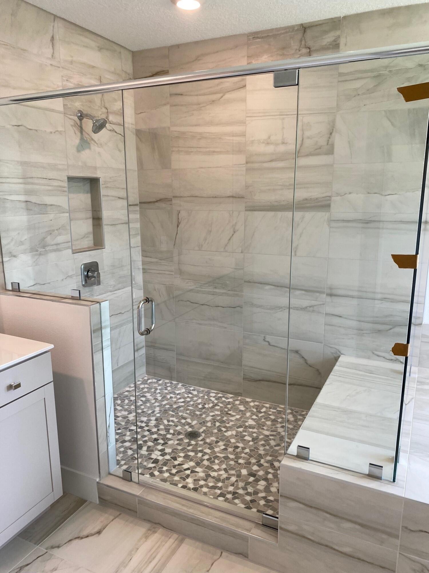 6810 Southeast Park Trace Drive Stuart, FL 34997 - Photo 15 of 21 a bathroom with a shower