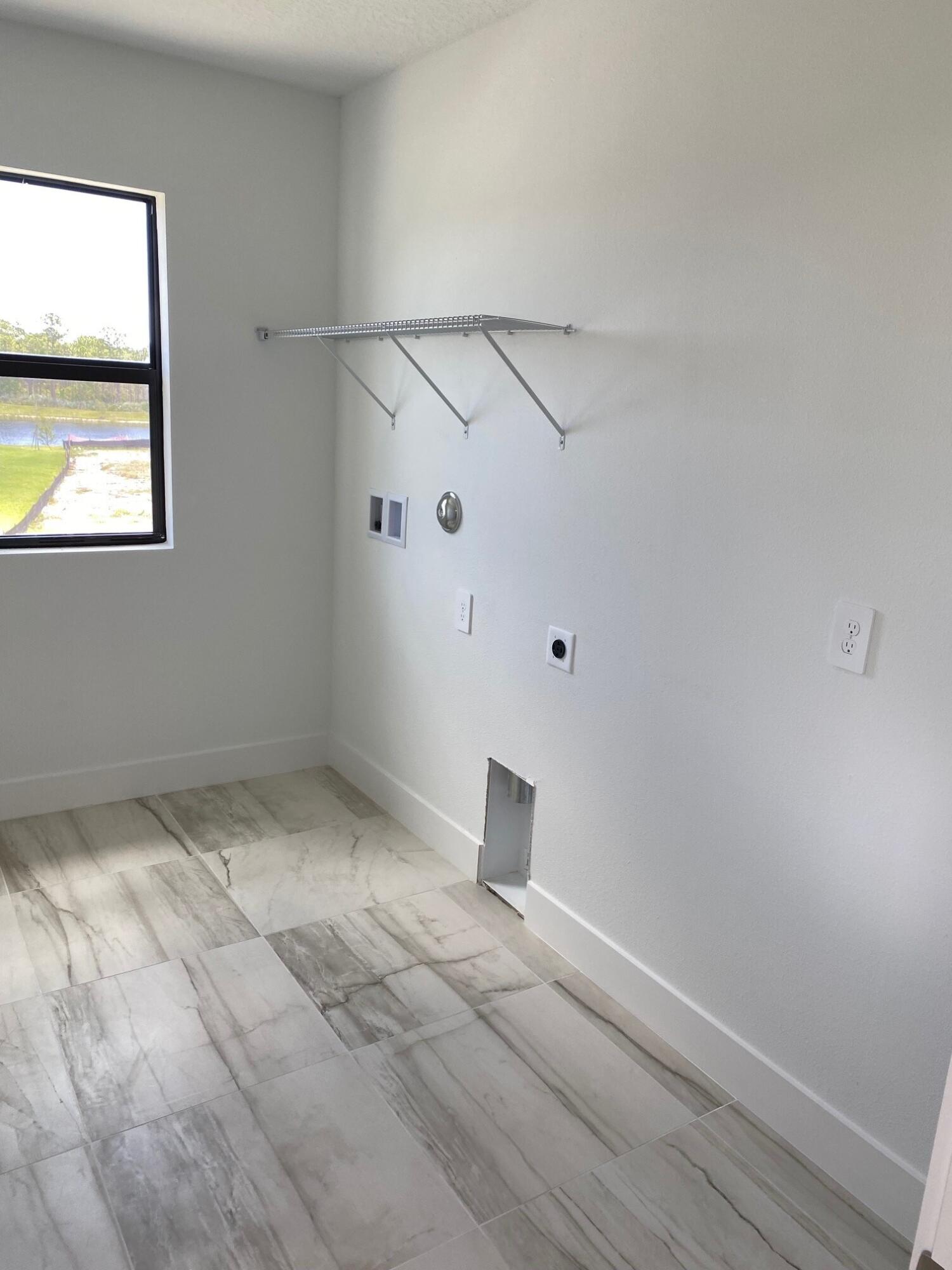 6810 Southeast Park Trace Drive Stuart, FL 34997 - Photo 17 of 21 a view of a room with rack and wooden floor