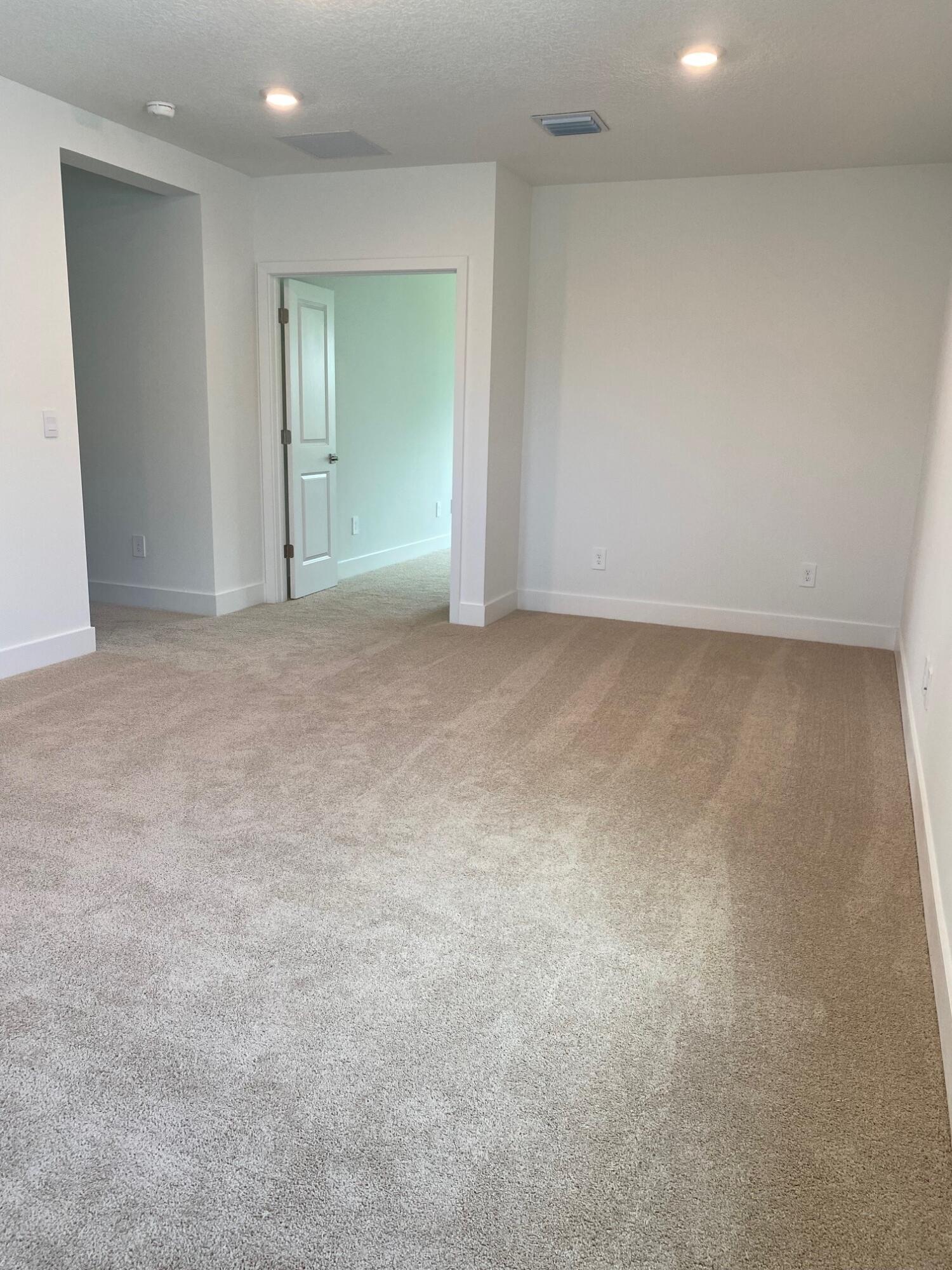 6810 Southeast Park Trace Drive Stuart, FL 34997 - Photo 18 of 21 a view of an empty room and closet area