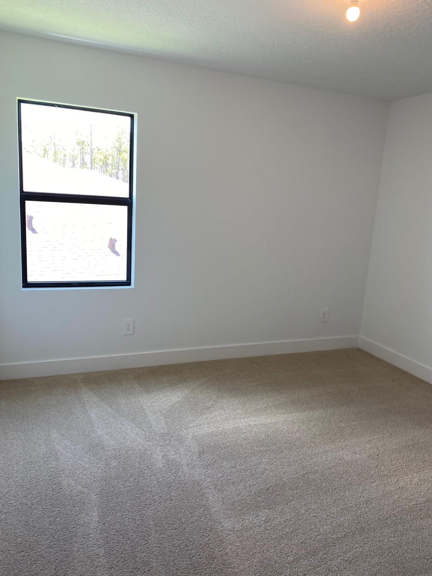 6810 Southeast Park Trace Drive Stuart, FL 34997 - Photo 9 of 21 a view of a window in an empty room