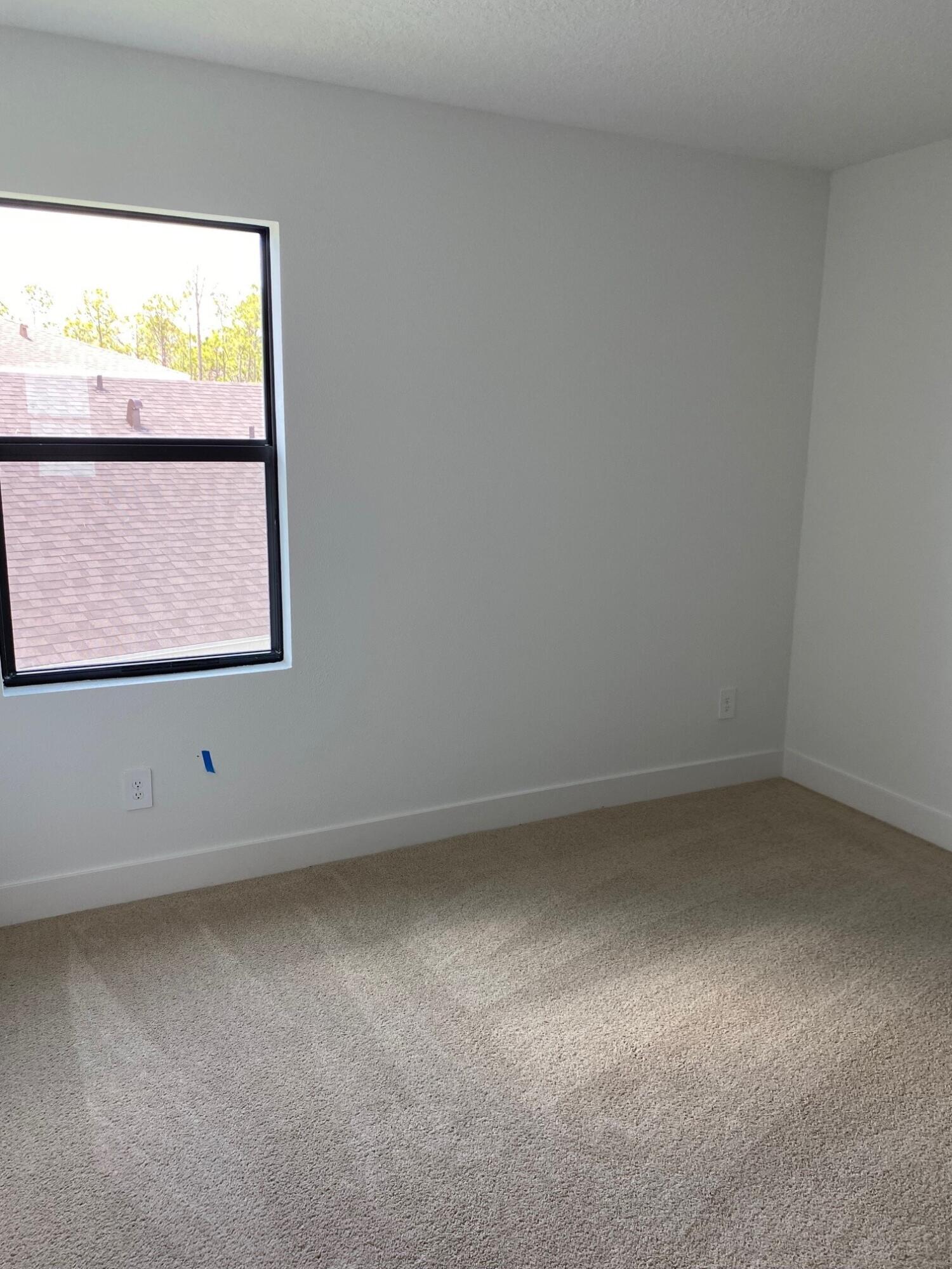 6810 Southeast Park Trace Drive Stuart, FL 34997 - Photo 10 of 21 an empty room with a window