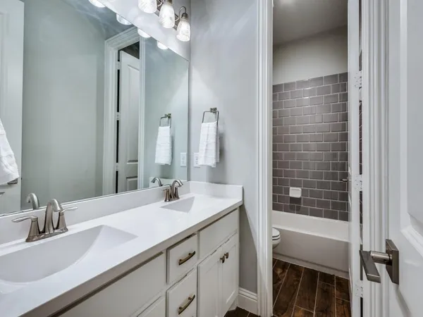 a bathroom with a sink a vanity and a mirror