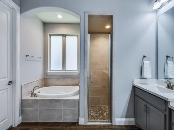 a bathroom with a bathtub and a sink