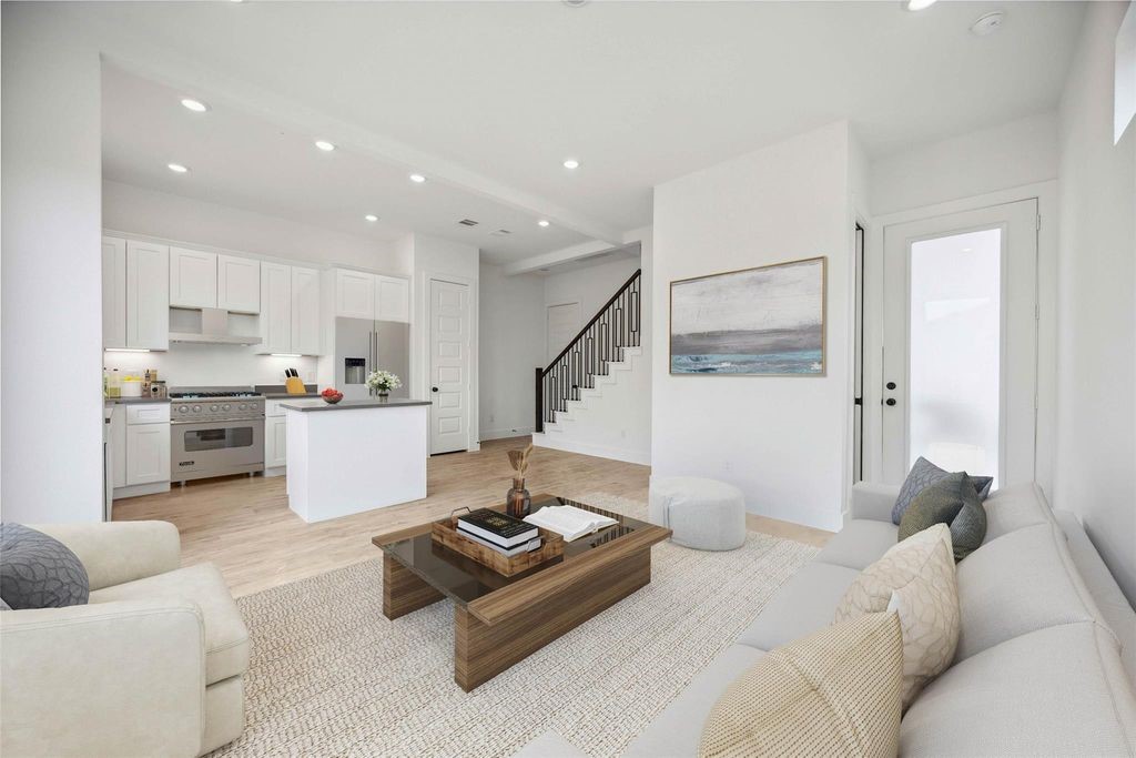8103 Calhoun Road Houston, TX 77051 - Photo 2 of 29 a living room with furniture and kitchen view