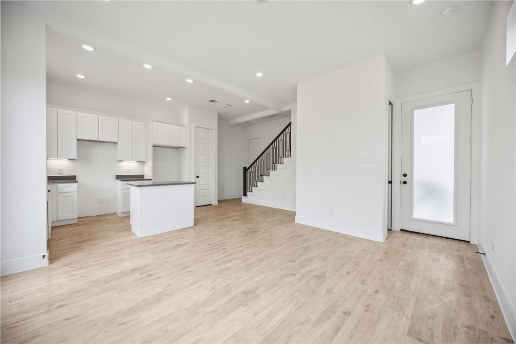 8103 Calhoun Road Houston, TX 77051 - Photo 21 of 29 a view of a kitchen with wooden floor and electronic appliances