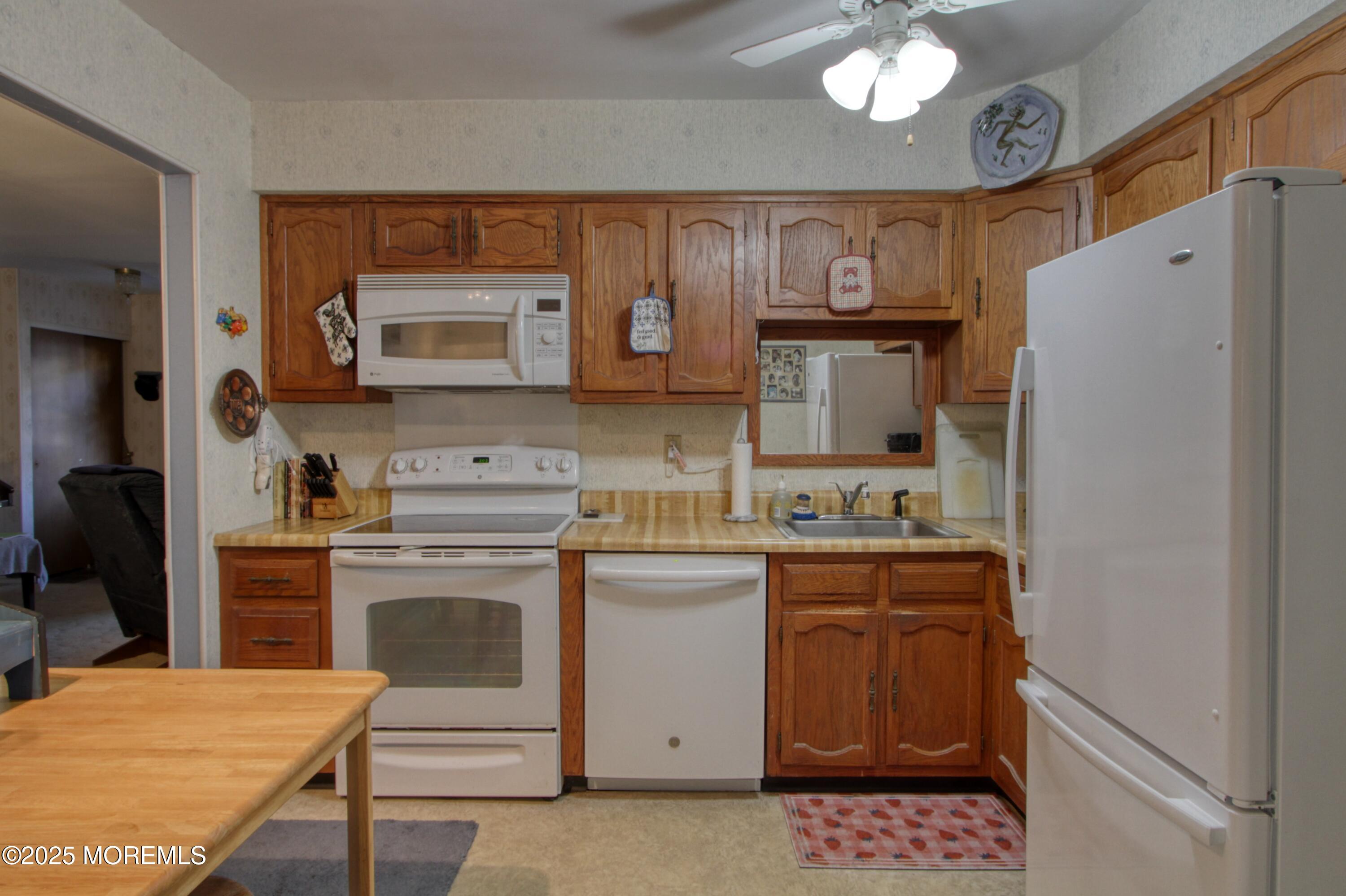 9 Greenleaf Street Whiting, NJ 08759 - Photo 2 of 16 a kitchen with stainless steel appliances a stove microwave and refrigerator