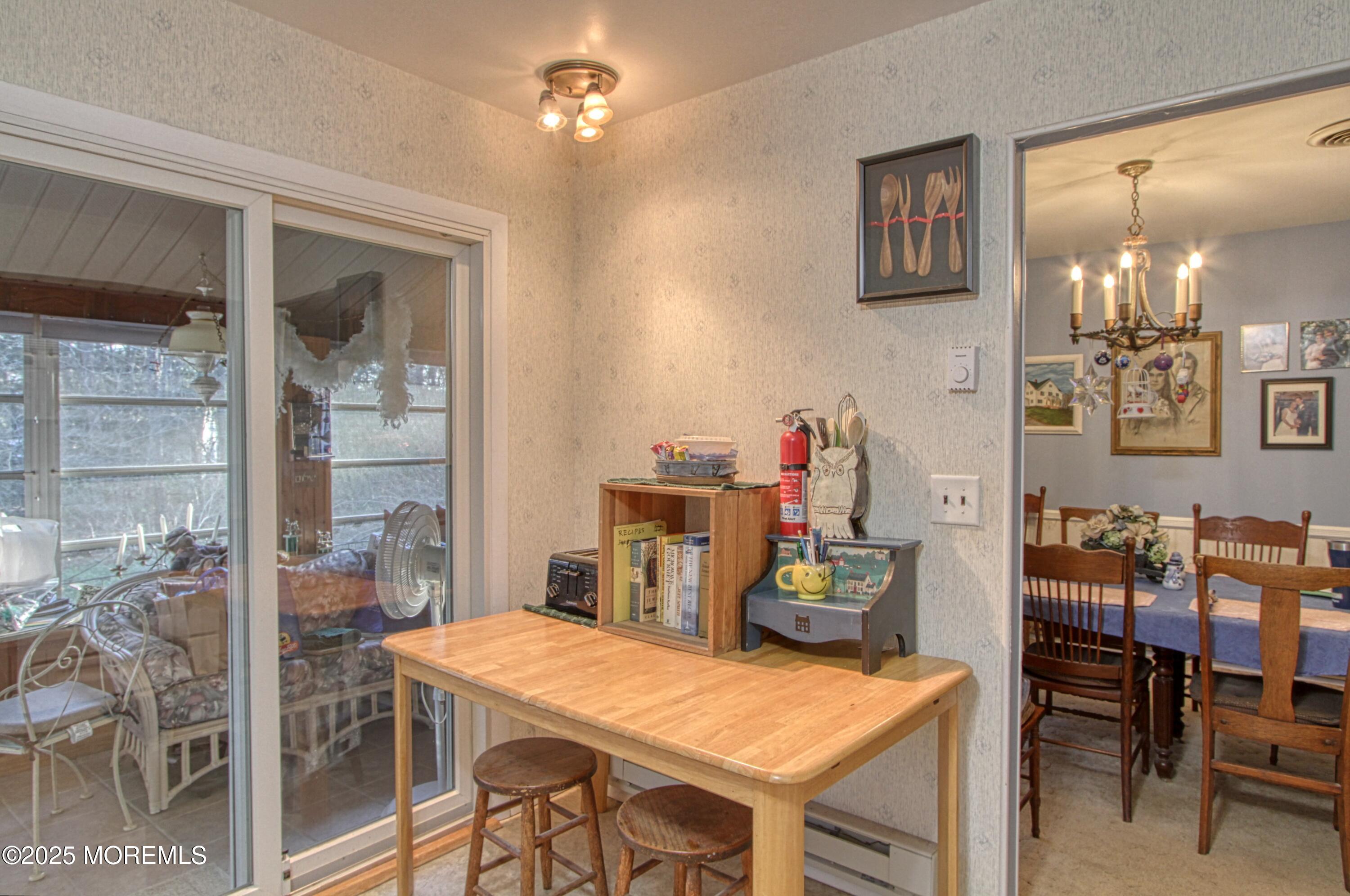 9 Greenleaf Street Whiting, NJ 08759 - Photo 4 of 16 a dining room with a table and chairs