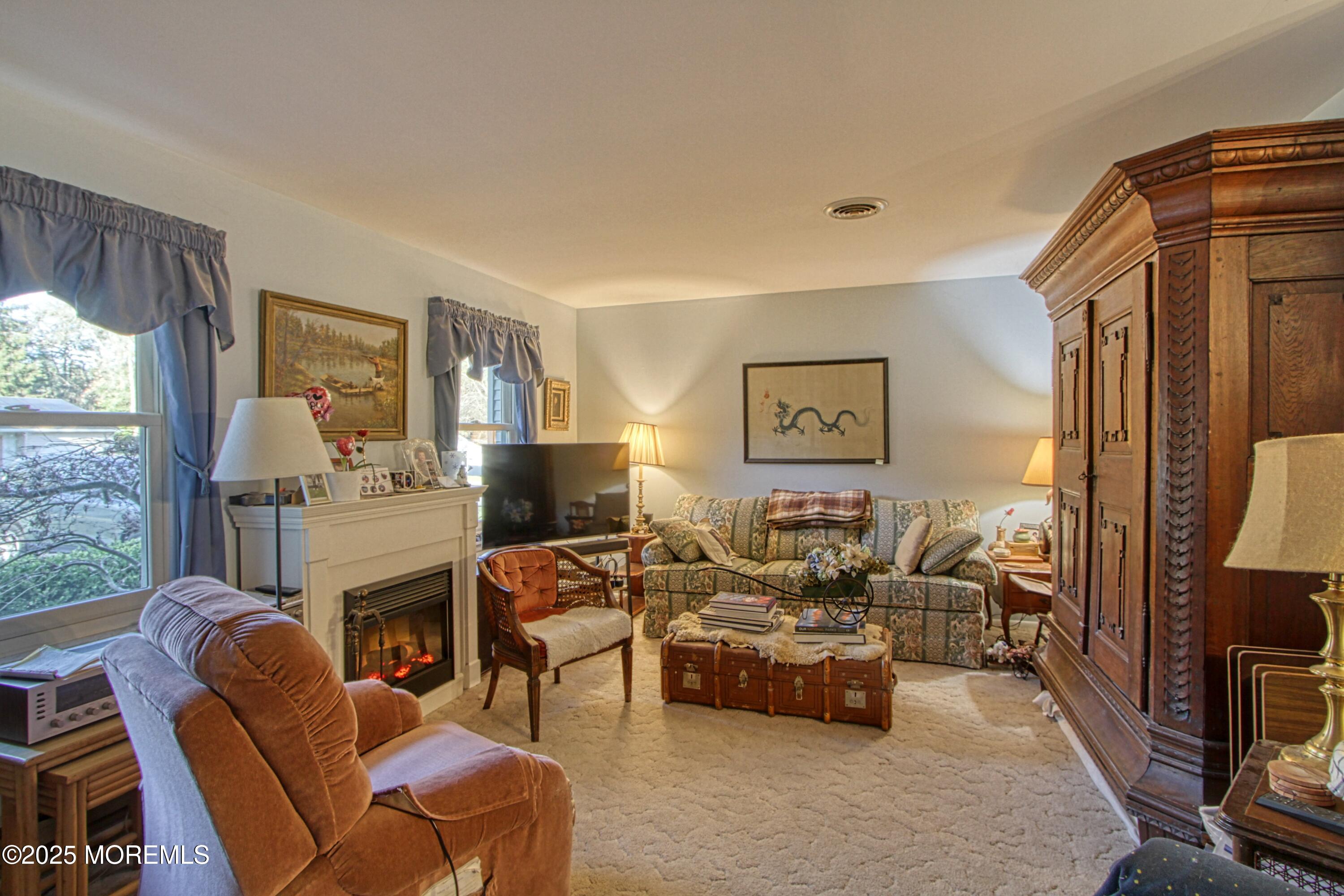9 Greenleaf Street Whiting, NJ 08759 - Photo 6 of 16 a living room with furniture fireplace and a large window