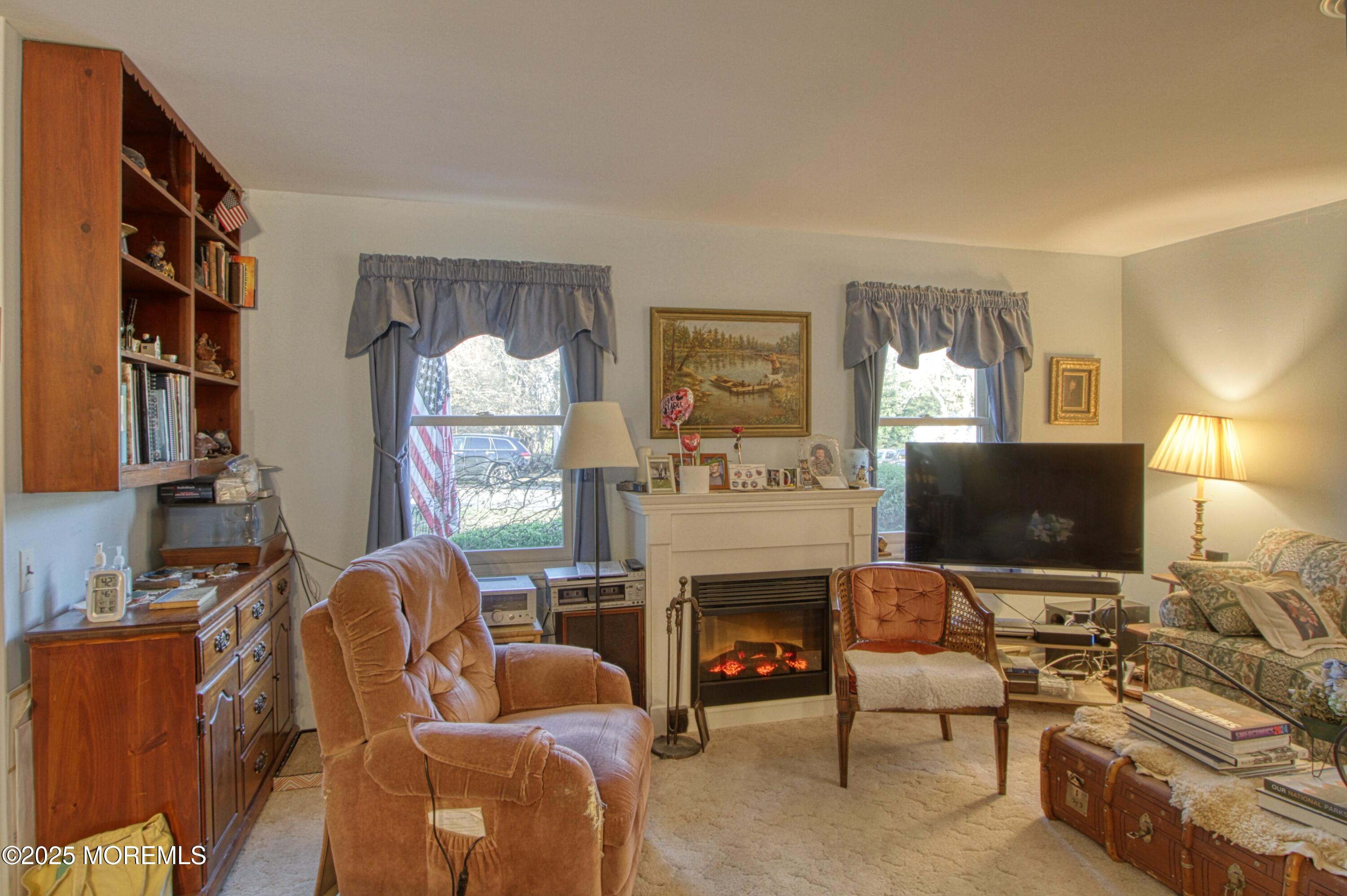 9 Greenleaf Street Whiting, NJ 08759 - Photo 7 of 16 a living room with furniture fireplace and a flat screen tv