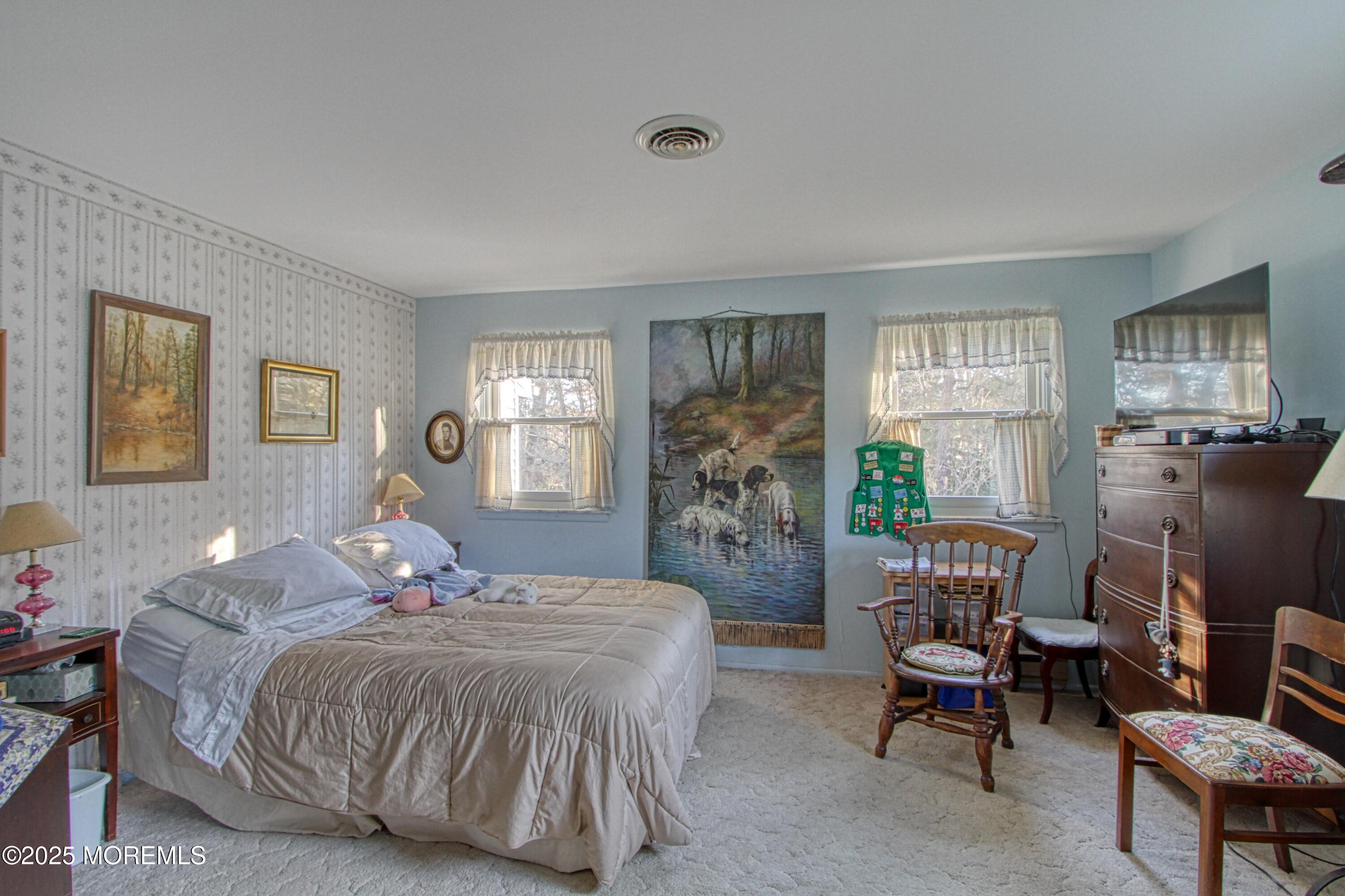 9 Greenleaf Street Whiting, NJ 08759 - Photo 8 of 16 a bedroom with a bed a table and chair