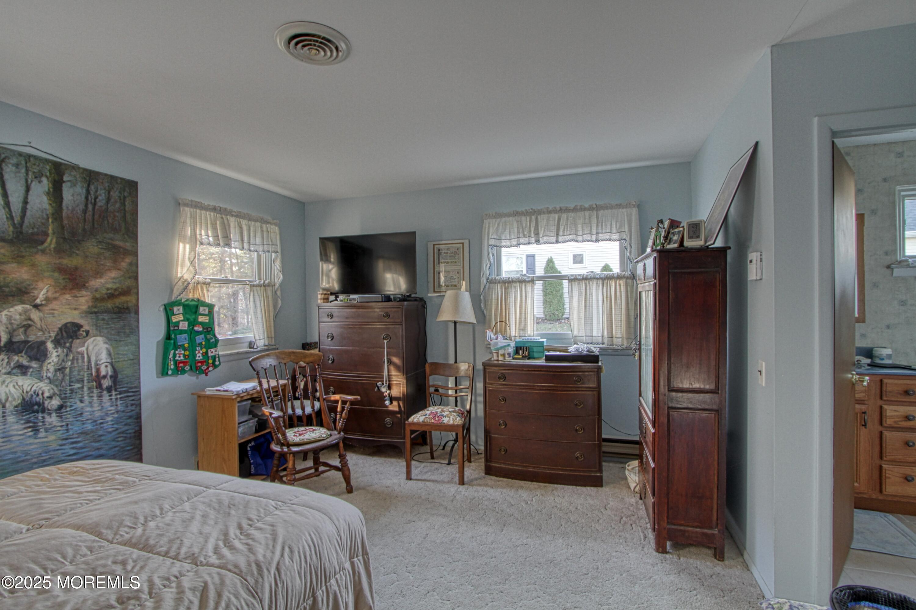 9 Greenleaf Street Whiting, NJ 08759 - Photo 10 of 16 a bedroom with a bed furniture and a flat tv screen