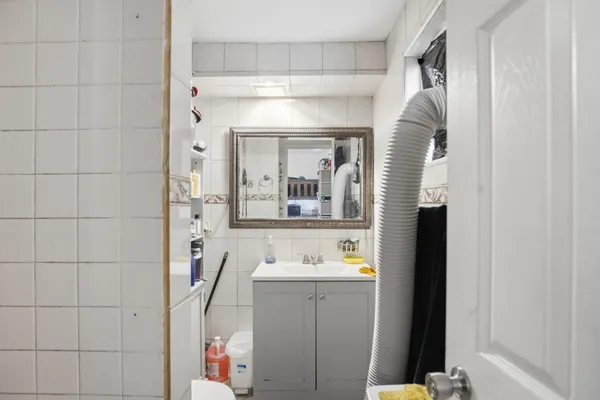 a bathroom with a sink and a mirror