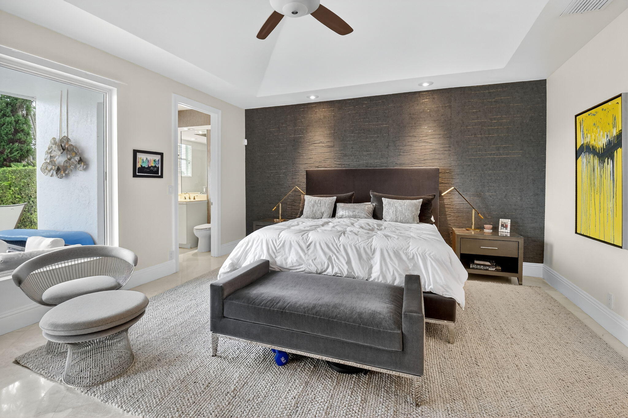 2563 Northwest 63rd Street Boca Raton, FL 33496 - Photo 26 of 65 a bedroom with a bed and glass windows