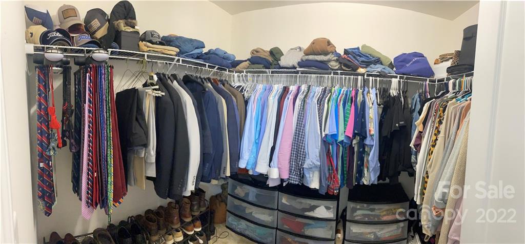 239 Elrosa Road Mooresville, NC 28115 - Photo 19 of 25 a view of walk in closet with clothes and shoes