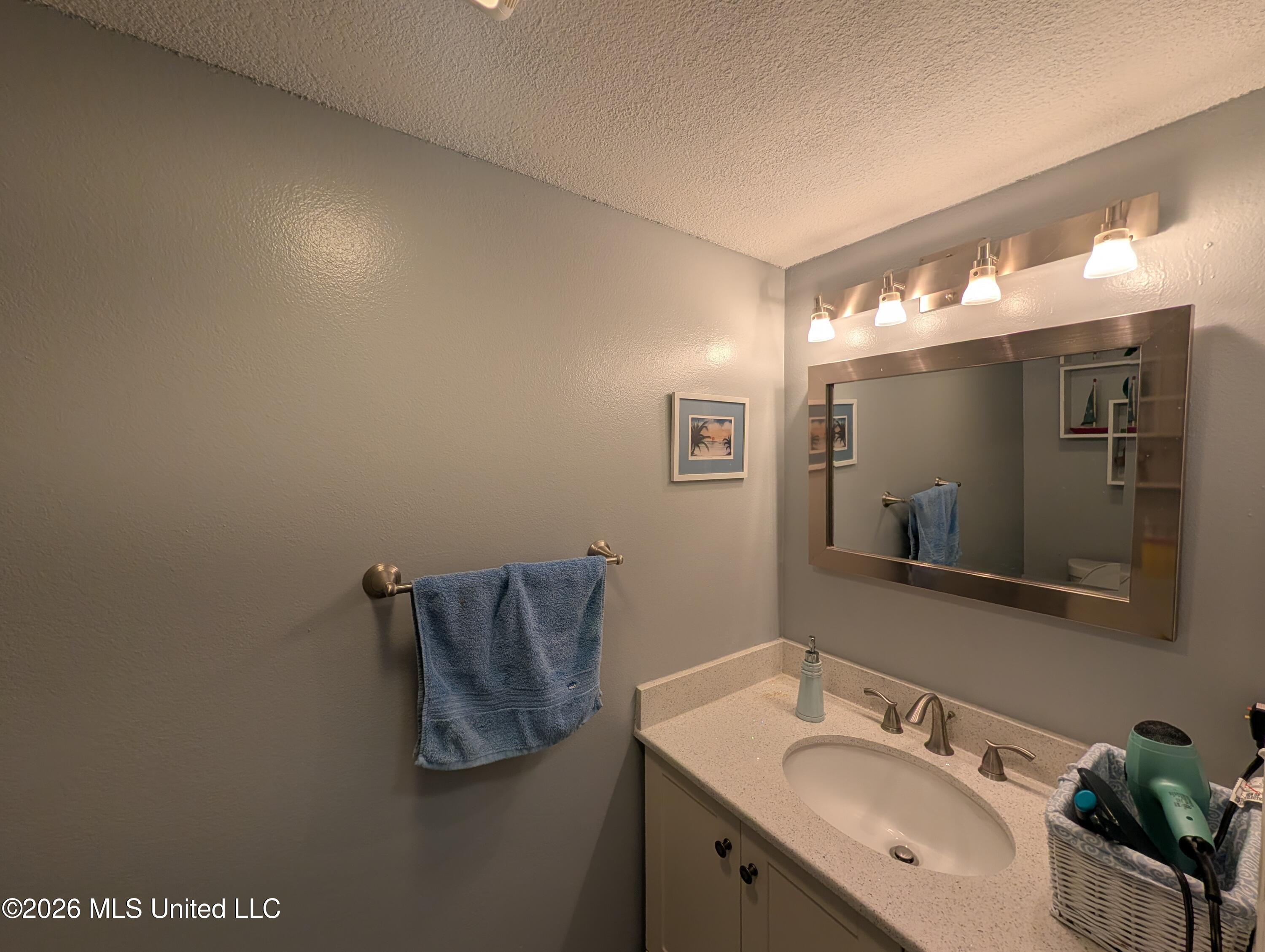 258 Highpoint Drive Diamondhead, MS 39525 - Photo 11 of 27 258 HP Halfbath downstairs