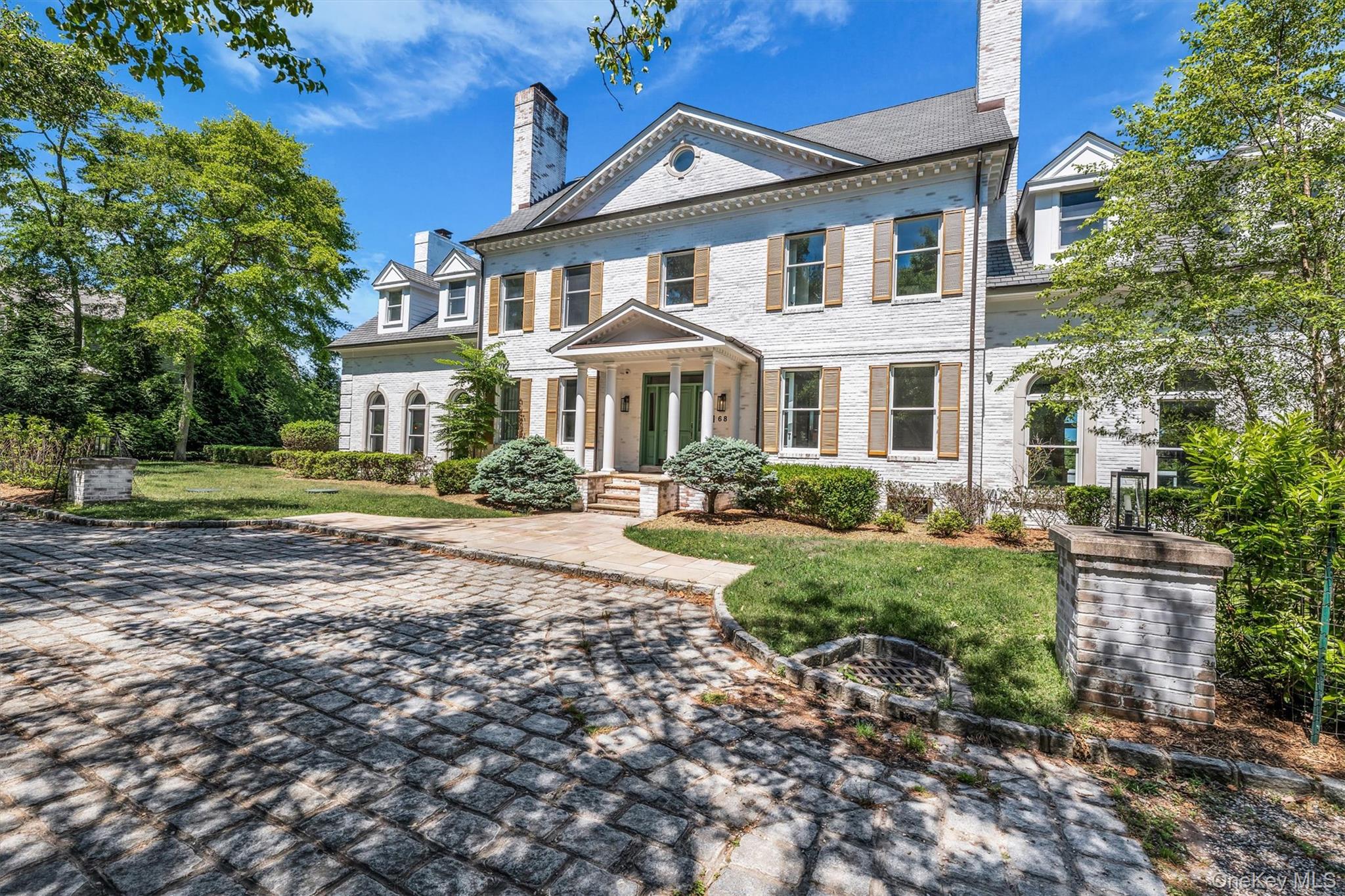 68 South Howells Point Road Bellport, NY 11713 - Photo 5 of 47 Stately white brick exterior
