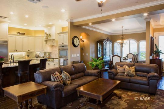 430 West Javis Avenue Ridgecrest, CA 93555 - Photo 8 of 35 a living room with furniture kitchen view and a chandelier