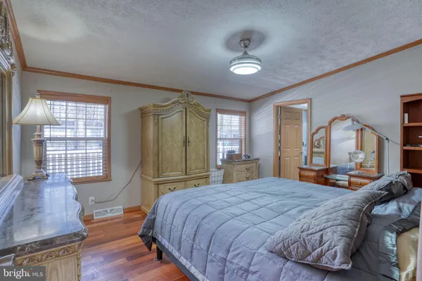 a room with cabinets and wooden floor
