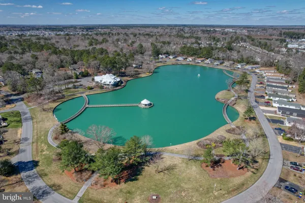 a view of a swimming pool with a yard