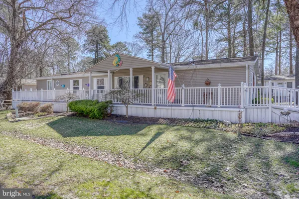 a view of a house with wooden deck