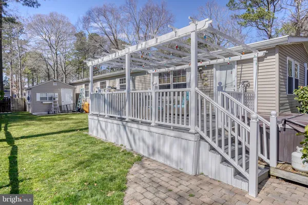 a view of house with backyard