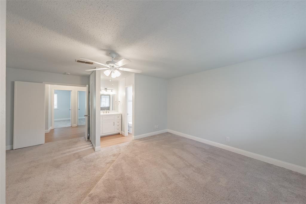 1301 Cedar Ridge Terrace Euless, TX 76039 - Photo 18 of 31 Spacious room featuring neutral carpet flooring and ceiling fan.
