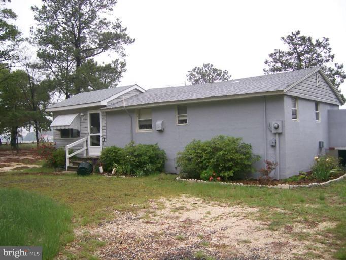16280 Murray Road Ridge, MD 20680 - Photo 11 of 15 a front view of a house with garden